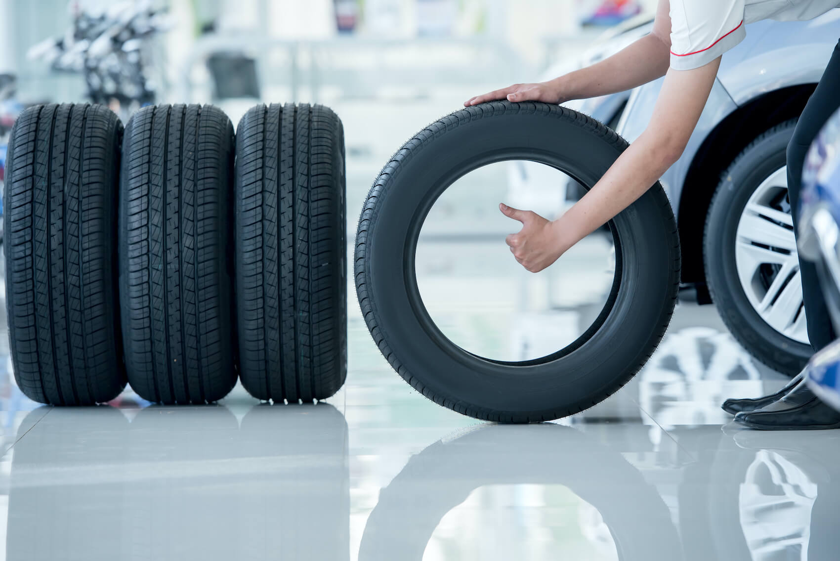 Man pushing tire