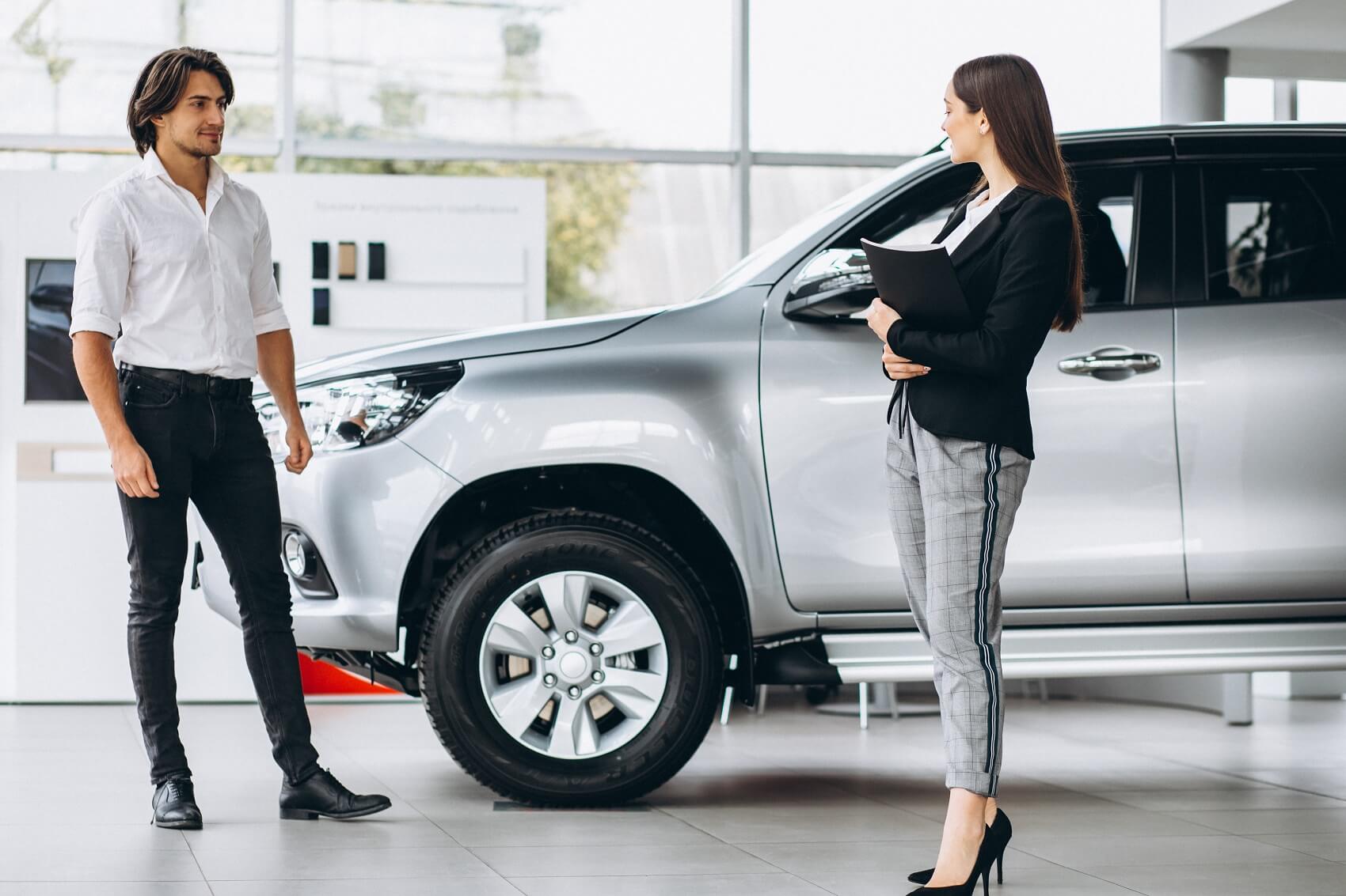 Two people visiting dealership